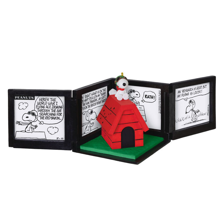Snoopy as the Flying Ace on red doghouse airplane, comic panel backdrop, Peanuts 75th anniversary Hallmark Christmas musical ornament
