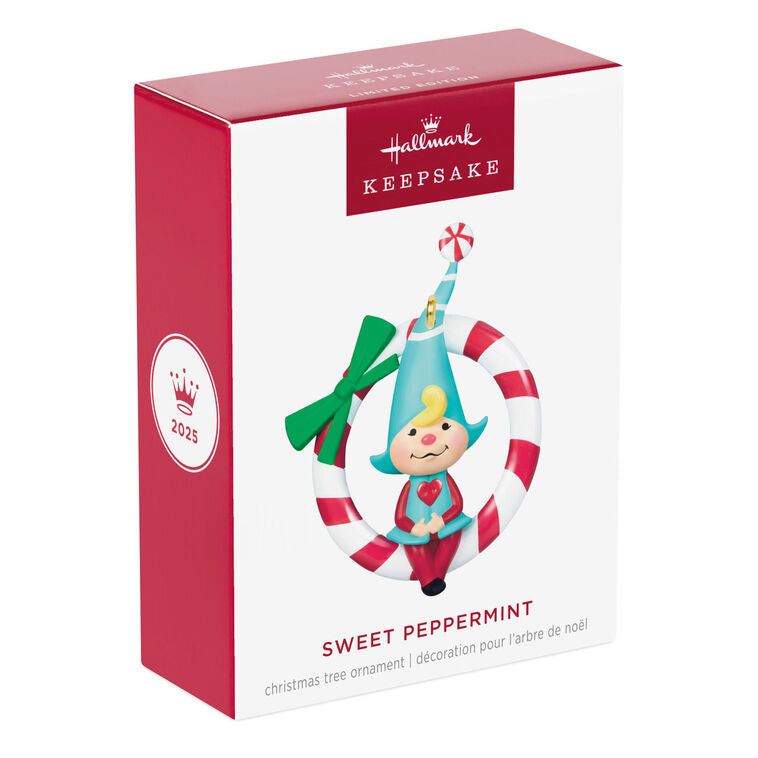 Hallmark Keepsake Sweet Peppermint girl gnome ornament in red and blue, sitting on candy cane wreath with green bow.