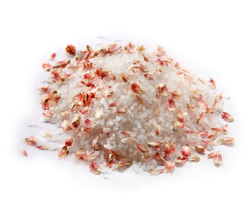 A 150g floral-infused bath salt gift set in decorative packaging, available in pink jasmine, white poppy.


