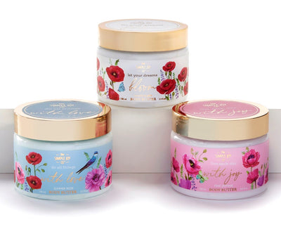 A 150 ml Wings of Summer body butter in an elegant jar, available in assorted scents like Pink , Rose, and White Poppy.