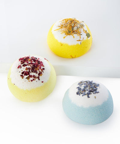 A 75g floral-infused bath fizzer in a decorative gift box, available in assorted scents like Honeysuckle Rose, Lemon Blossom.