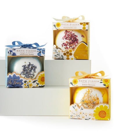 A 75g floral-infused bath fizzer in a decorative gift box, available in assorted scents like Honeysuckle Rose, Lemon Blossom.