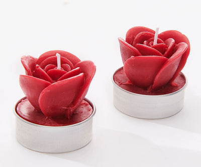 A paraffin wax rose-shaped candle with a lead-free wick, available in red or white; perfect for holiday decor or gifting.
