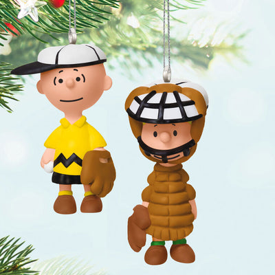 Set of two mini ornaments: Charlie Brown in baseball hat and glove, Schroeder in catcher’s gear, Hallmark Peanuts Christmas collectibles
