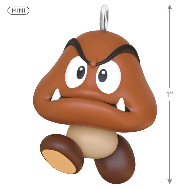 Hallmark Keepsake Mini Nintendo Super Mario Goomba ornament—brown mushroom-like enemy with sharp teeth, large eyes, oval feet, and angry eyebrows

