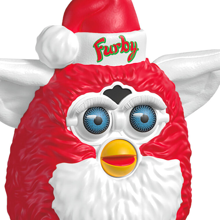 Festive Furby ornament, red and white electronic toy with blue eyes, yellow beak, Santa hat, Hallmark Keepsake, Christmas decoration.