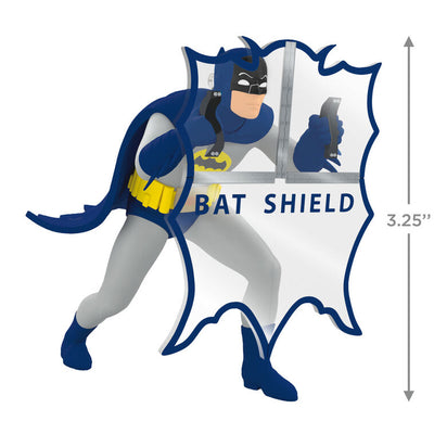 Batman ornament holding Bat-Shield from 1960s TV series, blue and gray costume with yellow accents, nostalgic superhero decoration