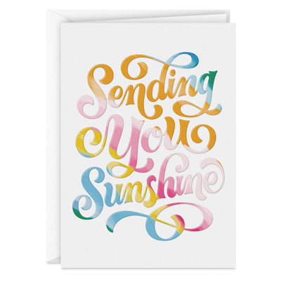 White blank note cards with colorful embossed “Sending You Sunshine” lettering in pink, orange, yellow, blue, and green.
