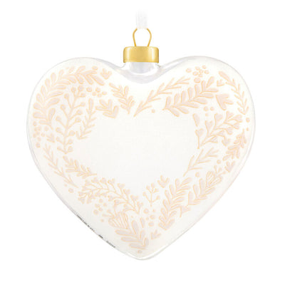 Glass heart Christmas ornament with snow, gold greenery accents, and “Our Christmas Together 2025” message.

