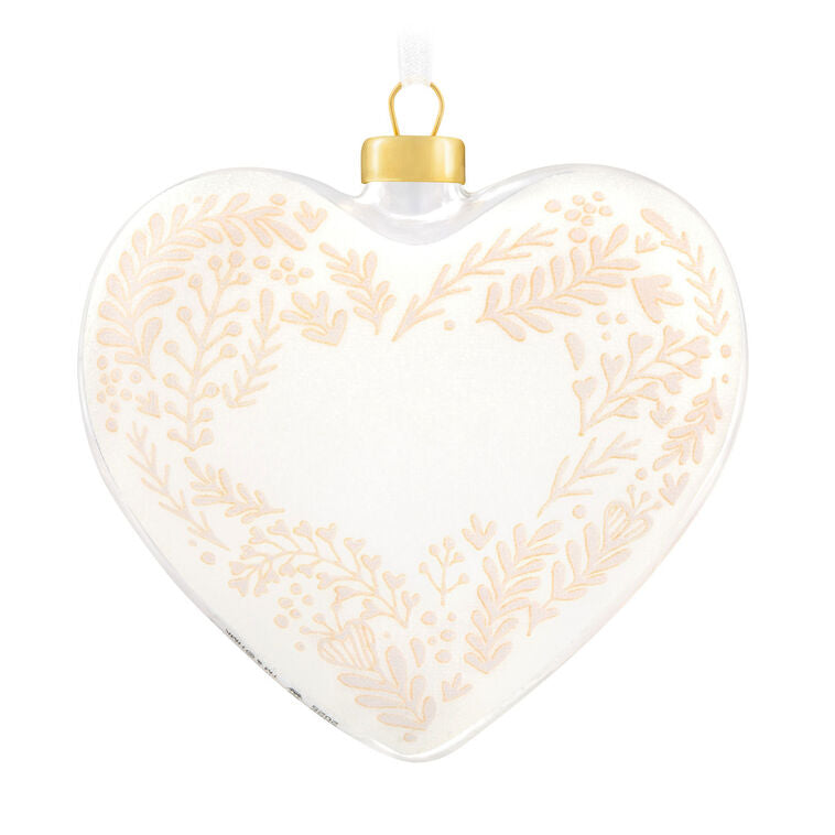 Glass heart Christmas ornament with snow, gold greenery accents, and “Our Christmas Together 2025” message.

