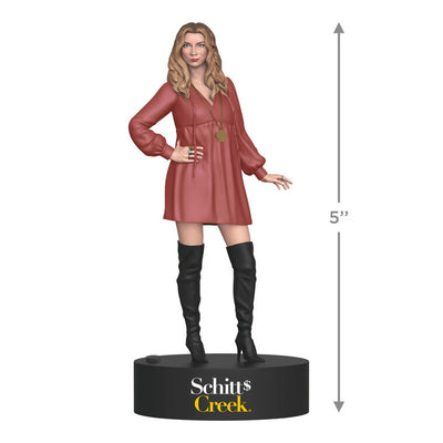 Alexis Rose ornament from Schitt's Creek in pink baby-doll dress with black boots, sound button on base.