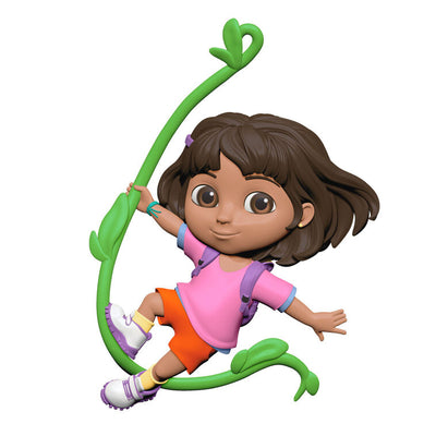 Dora the Explorer ornament swinging on jungle vine, pink shirt, orange shorts, purple backpack, Hallmark Keepsake holiday decor.