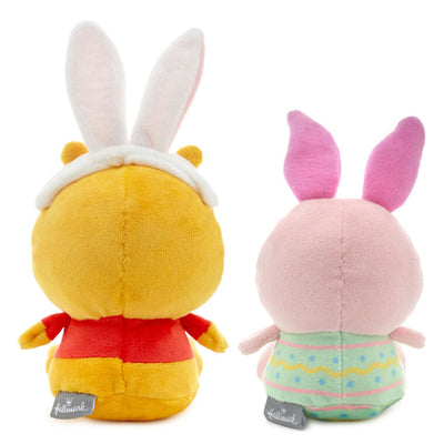 Disney plush Pooh in bunny ears and Piglet in an Easter egg outfit with magnetic connectors for spring gifting.
