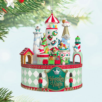 Musical Christmas village ornament with Santa, characters, spinning train, lights, and holiday carols, battery operated

