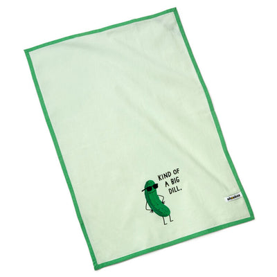 White tea towel with green border, featuring a dill pickle in sunglasses and the phrase: “Kind of a big dill.”