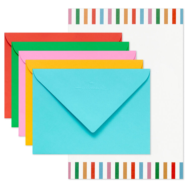 Stationery set with white sheets bordered in bright vertical stripes and colorful envelopes in pink, green, orange, rose, and aqua.
