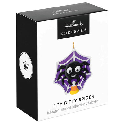 Mini Halloween spider ornament holding candy corn in sparkly web, perfect for tabletop tree display