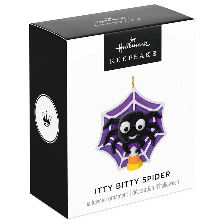 Mini Halloween spider ornament holding candy corn in sparkly web, perfect for tabletop tree display