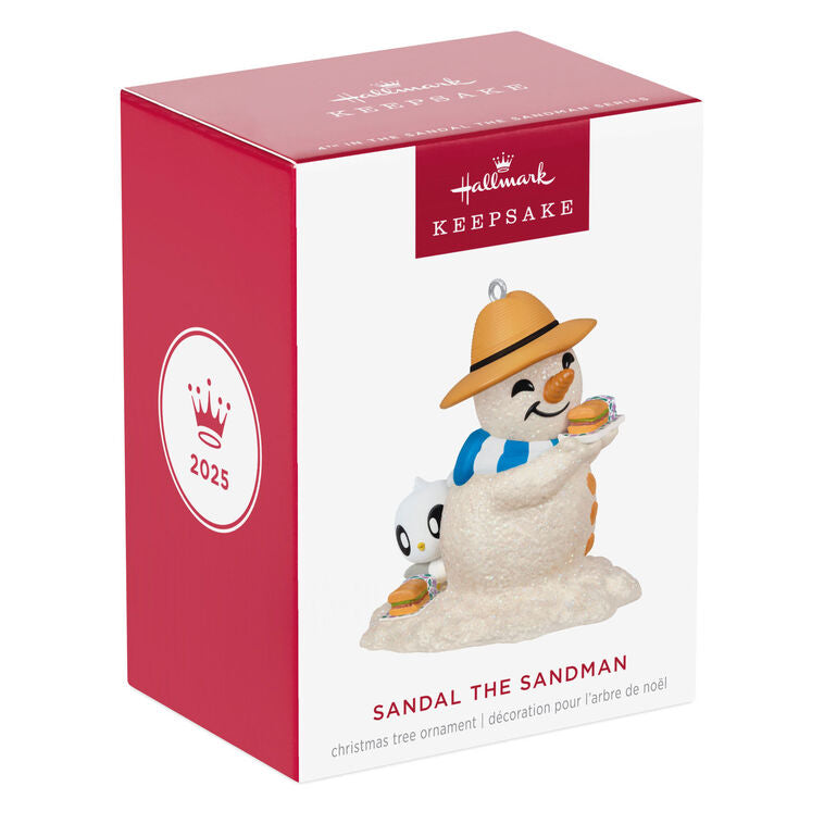 Hallmark Keepsake Sandal the Sandman ornament—sand snowman in Bermuda hat, blue and white scarf, with sub sandwich and sea turtle friend on the beach
