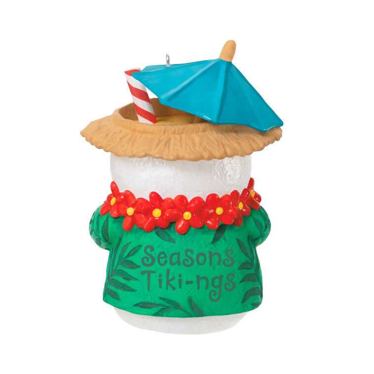 Snowman tiki drink ornament wearing green shirt and red lei with cocktail umbrella and striped straw, festive holiday decor

