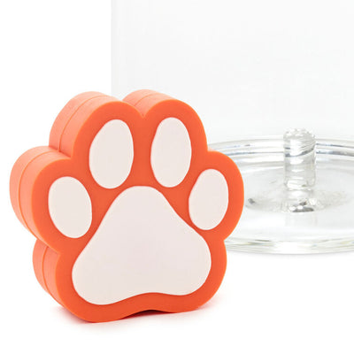 Orange and white paw print silicone drink charm, fits in Charmers glasses; great for pet lovers, adoptions, or vet gifts.