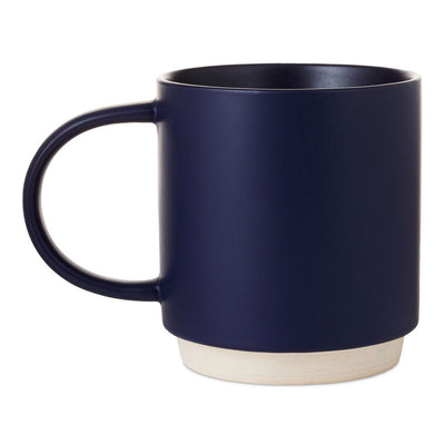 Midnight blue ceramic mug with "Keep it reel" pun, fishing rod and lure design, oversized handle, and recessed stacking base.