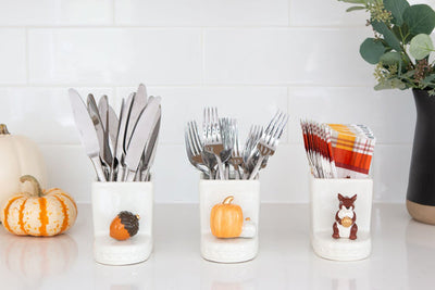 A ceramic mini pumpkin with warm pumpkin spice colors, perfect for fall and seasonal décor.

