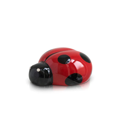 Red ladybug figurine with black spots
