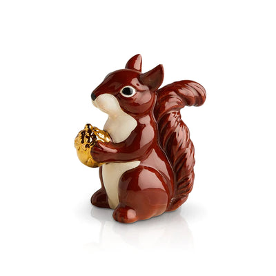 Mini figurine of a squirrel holding a gold acorn