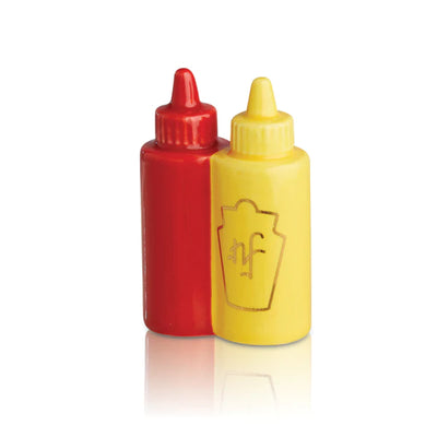 Two condiment bottles, red ketchup and yellow mustard, side-by-side