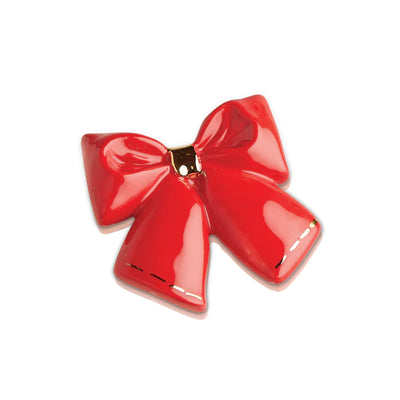 Red ribbon with two silver bells on a white background