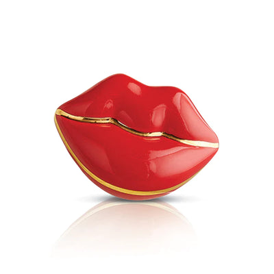 Red lip with gold accent on white background