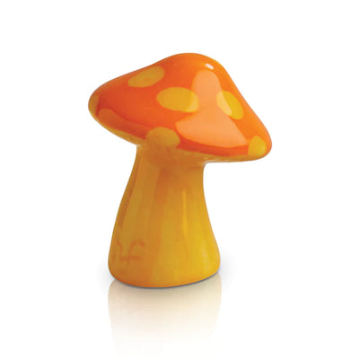 Orange and yellow mushroom with white spots on a white background
