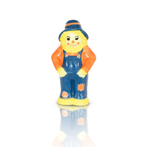 Autumn-themed scarecrow mini figurine from Nora Fleming with straw hat and plaid shirt, perfect for fall table decor.

