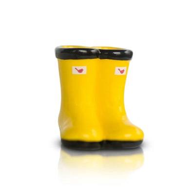 Yellow rain boots with red birds on white background