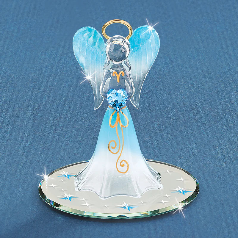 Handcrafted glass angel figurine holding a heart-shaped blue crystal, with 22Kt gold accents and air brushing