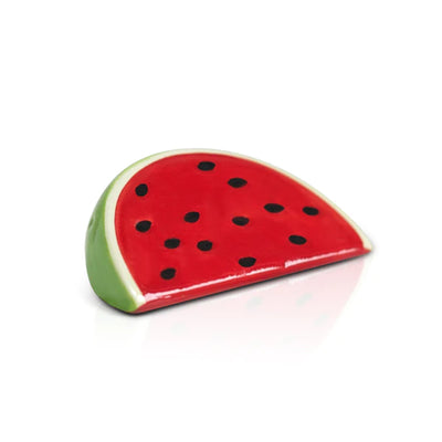 Slice of watermelon with black seeds on white background