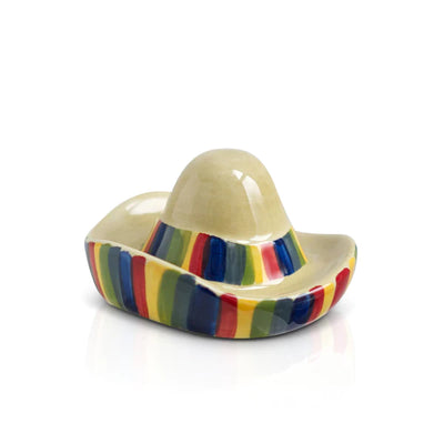 Colorful, ceramic sombrero with red stripes on white background