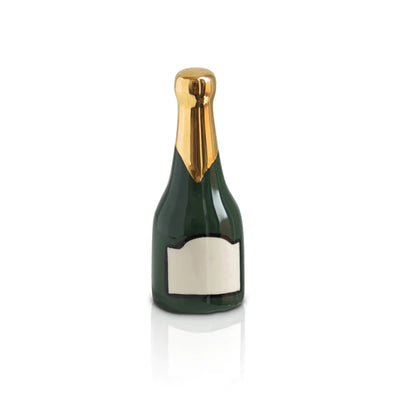 Small champagne bottle with white label and gold crown on white background