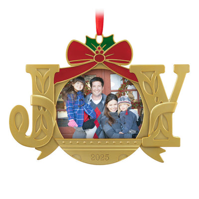 Gold JOY word-art photo frame ornament with red bow and holly topper, features 2025 date and holds a small holiday photo.