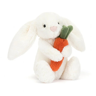 White stuffed bunny rabbit holding a carrot