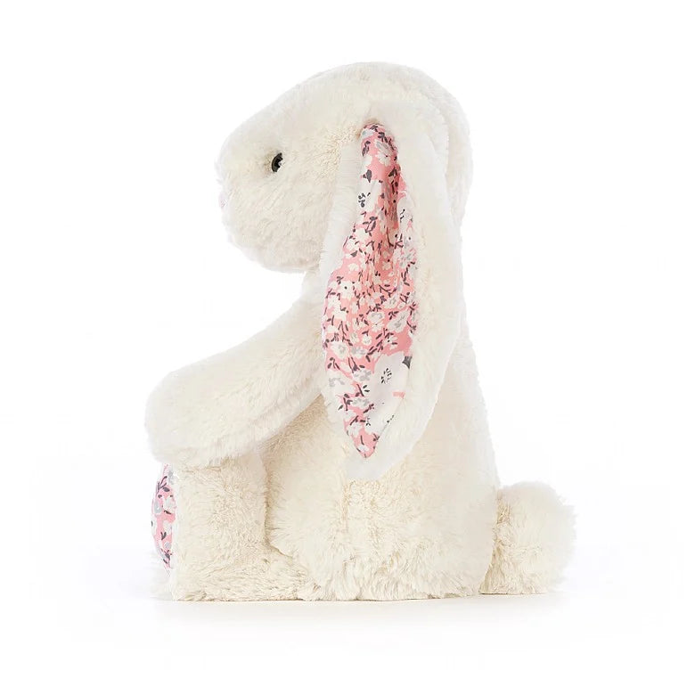 White rabbit with pink flowers on ears