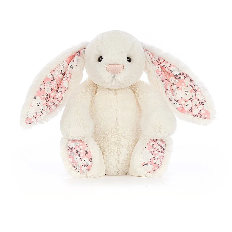 White rabbit with pink flowers on ears