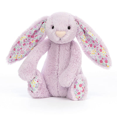 Stuffed bunny rabbit with flowers on ears