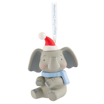 Gray elephant ornament with Santa hat and pink scarf, holding a 2025 baby girl’s first Christmas ribbon.