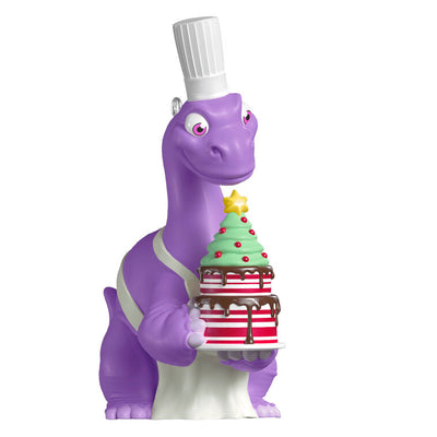 Purple Brachiosaurus in chef’s hat and apron holds a candy cane cake in this festive Hallmark Keepsake Christmas dinosaur ornament.
