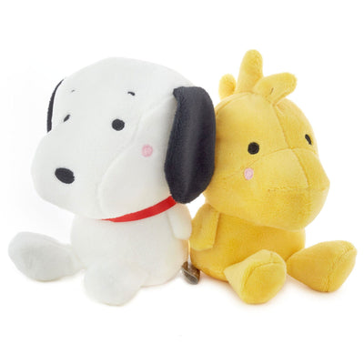 Two magnetic plush toys: a white dog and a yellow duck sitting side-by-side.