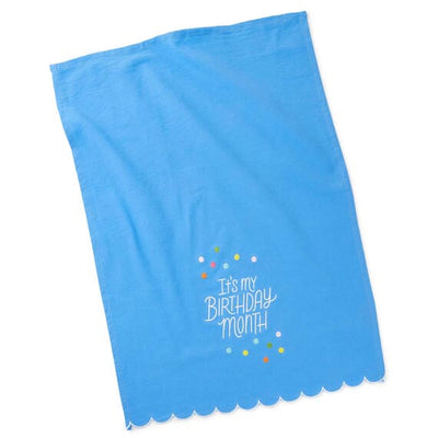 Hallmark birthday month gift set with blue embroidered tea towel and coordinating stemless wine glass, perfect for milestone 
