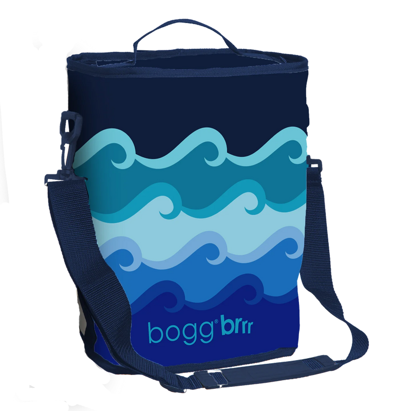 Half-size insulated Bogg cooler in Catch Waves print, fits Original Bogg Bag with shoulder strap and exterior pocket for small items.

