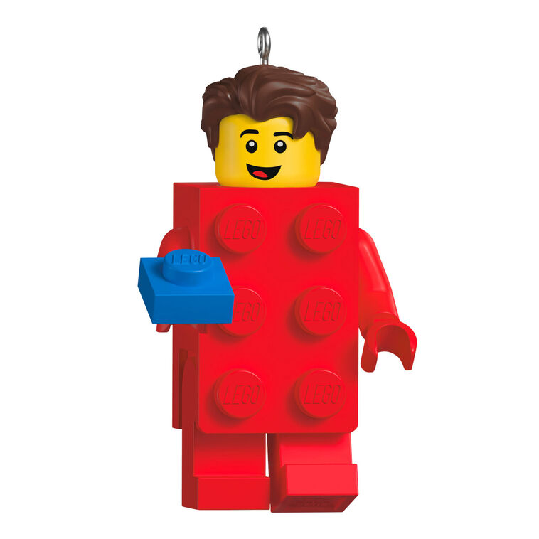 LEGO minifigure ornament with red brick body and blue hand-held piece, smiling boy with brown hair.